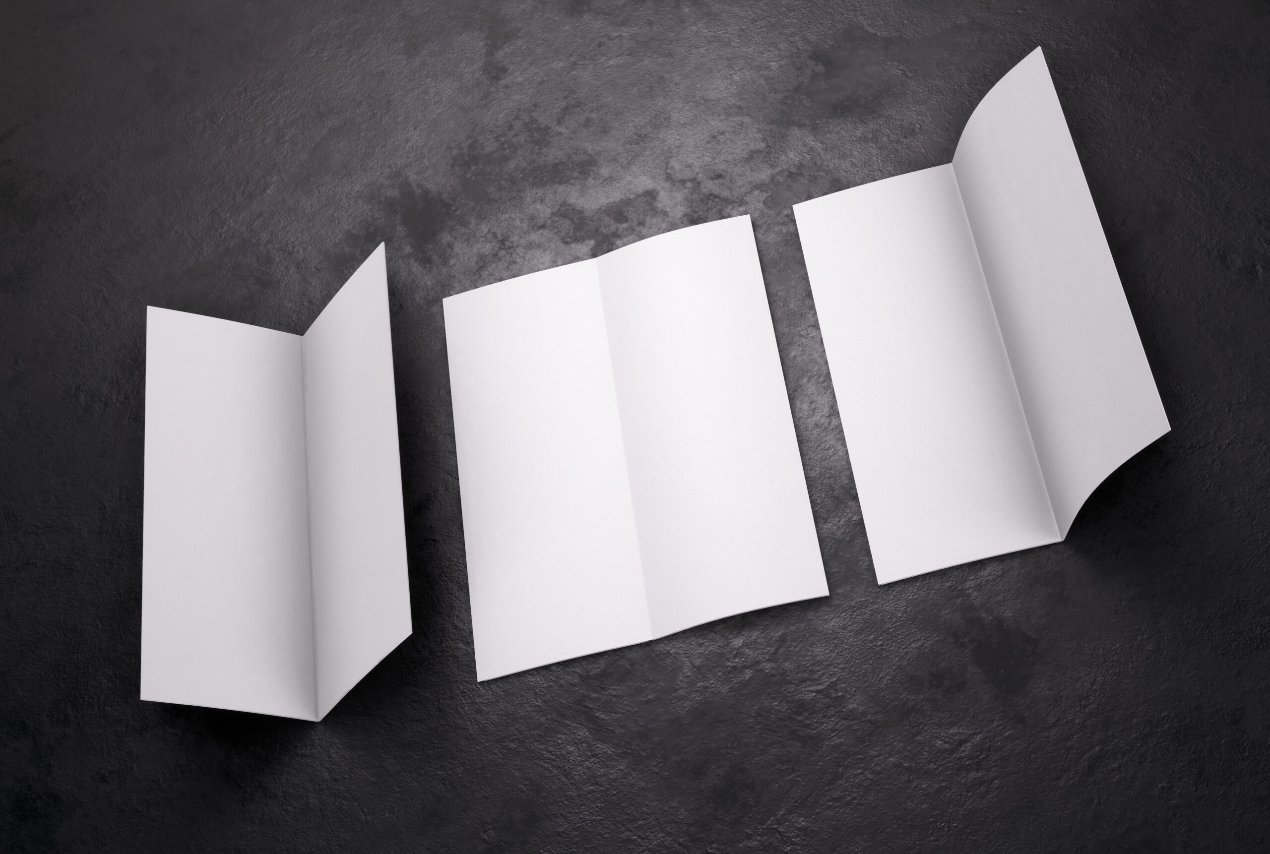 Blank white leaflet Mockup on black, booklet. 3d rendering.